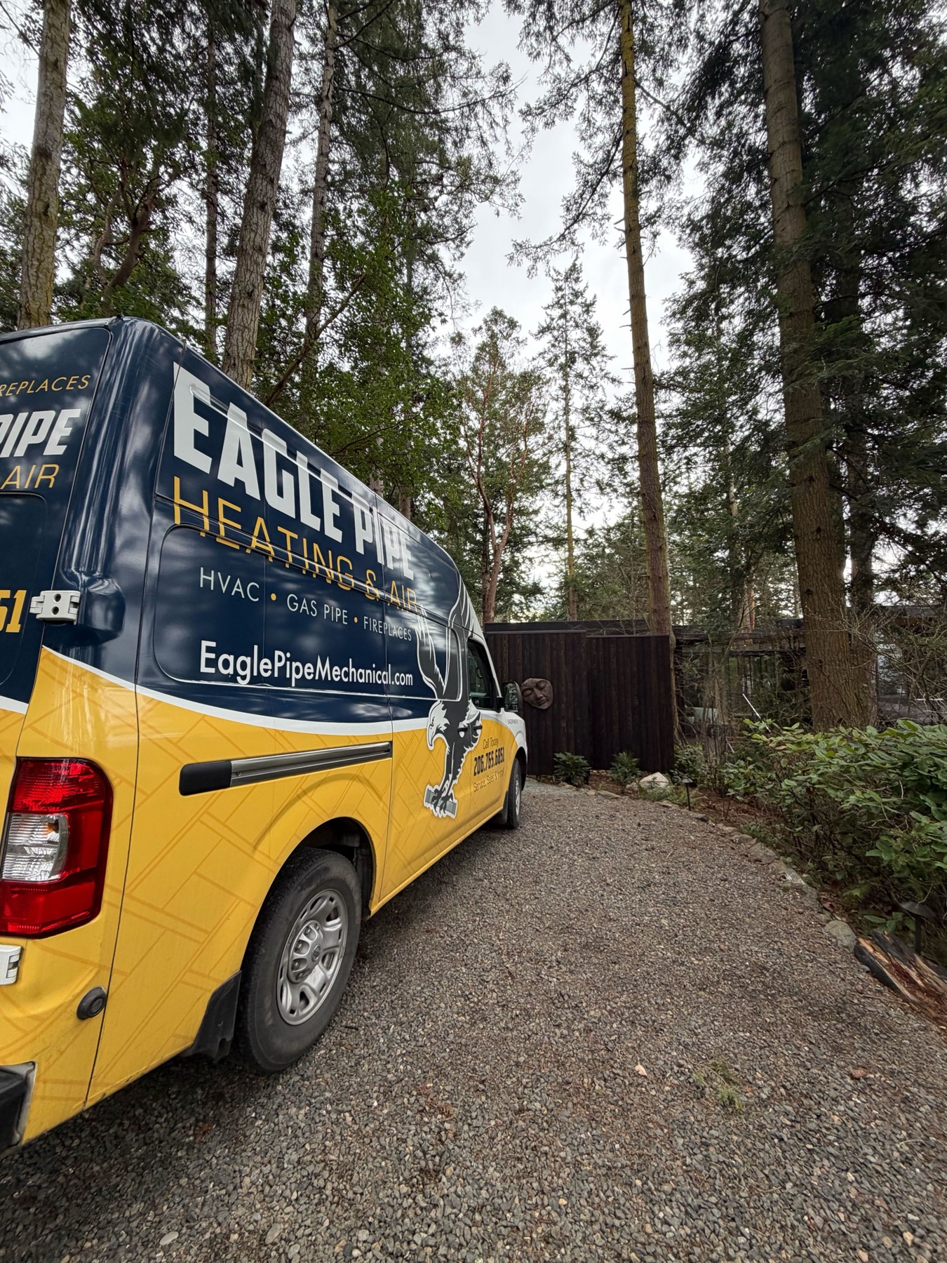 Eagle Pipe service van parked in a wooded Kitsap driveway